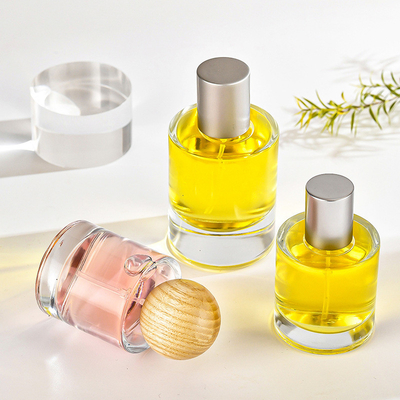 কেনা সুগন্ধি কাচের বোতল 30ml 50ml বেয়নেট সিলিন্ডার স্বচ্ছ পারফিউম সাবপ্যাকেজ কাঠের কভার সহ প্রসাধনী স্প্রে বোতল online manufacture