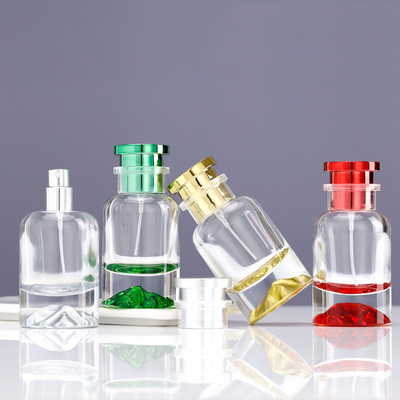কেনা ক্যাপ সহ রঙিন পারফিউমের বোতল online manufacture